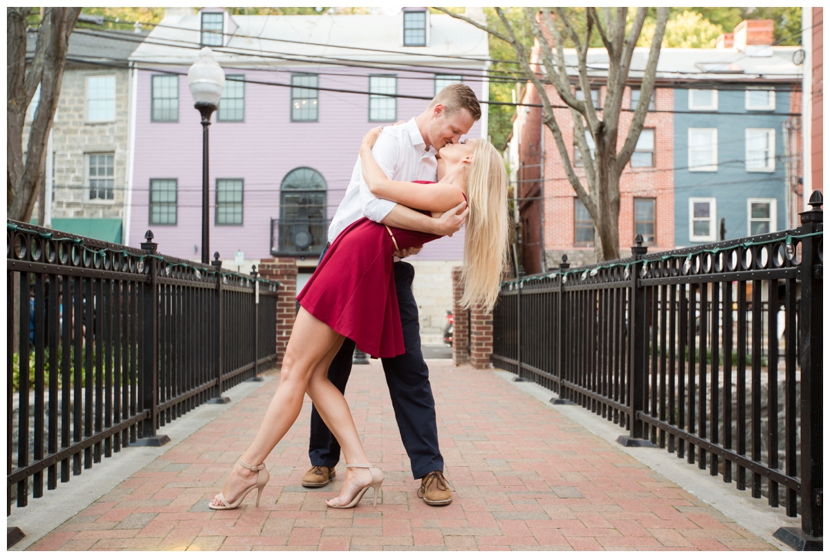 Ellicott City Engagement Photo by train bridge. Old Ellicott City. Dipping his bride to be.